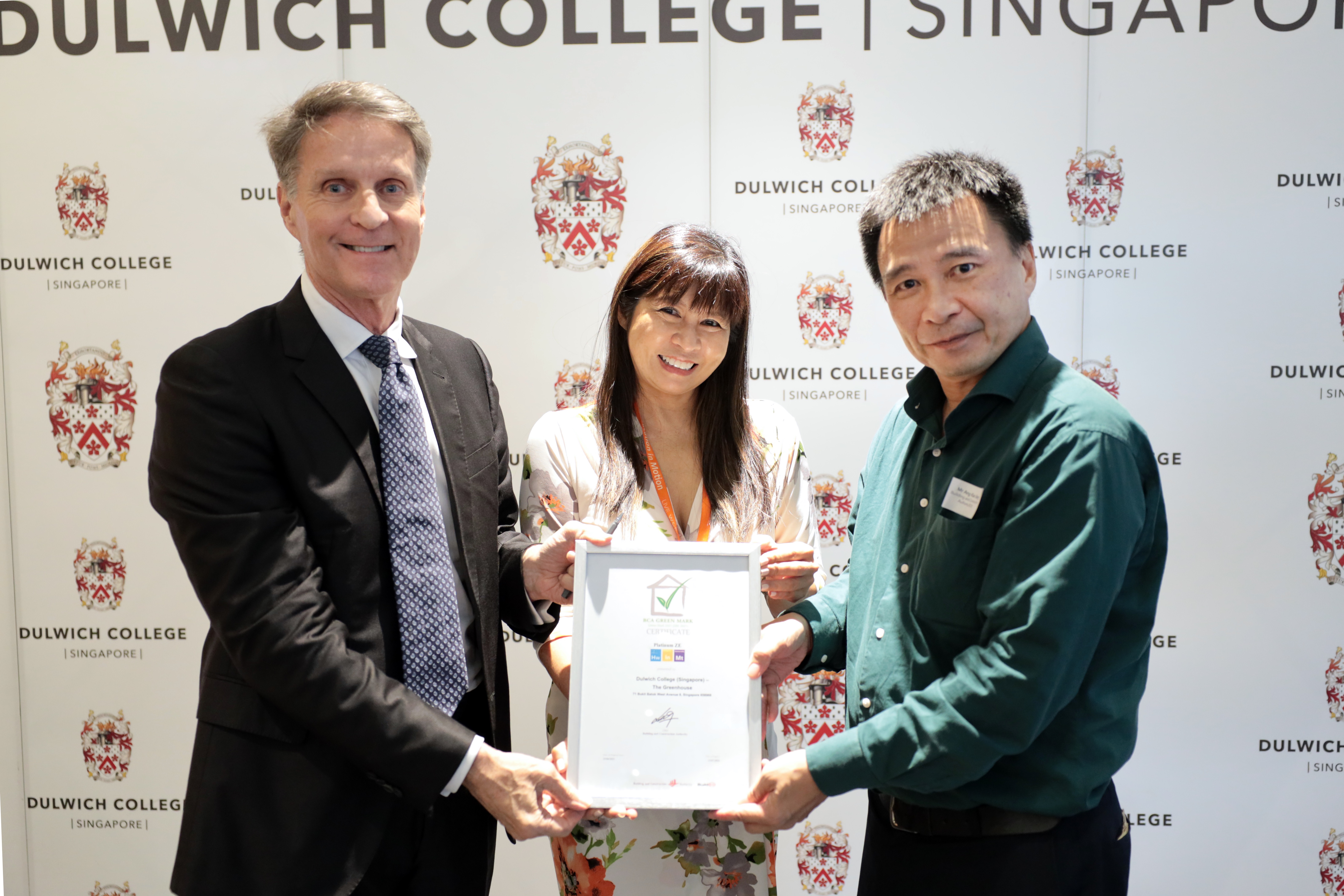 EiM founders receiving the Green Mark Platinum Zero Energy Certification from BCA. From left to right: Fraser White, Founder, Chairman and CEO, Education in Motion; Ms Karen Yung, Co-Founder and Chief Collaboration Officer, Education in Motion; and Mr Ang Kian Seng, Group Director of BCA’s Environmental Sustainability Group.