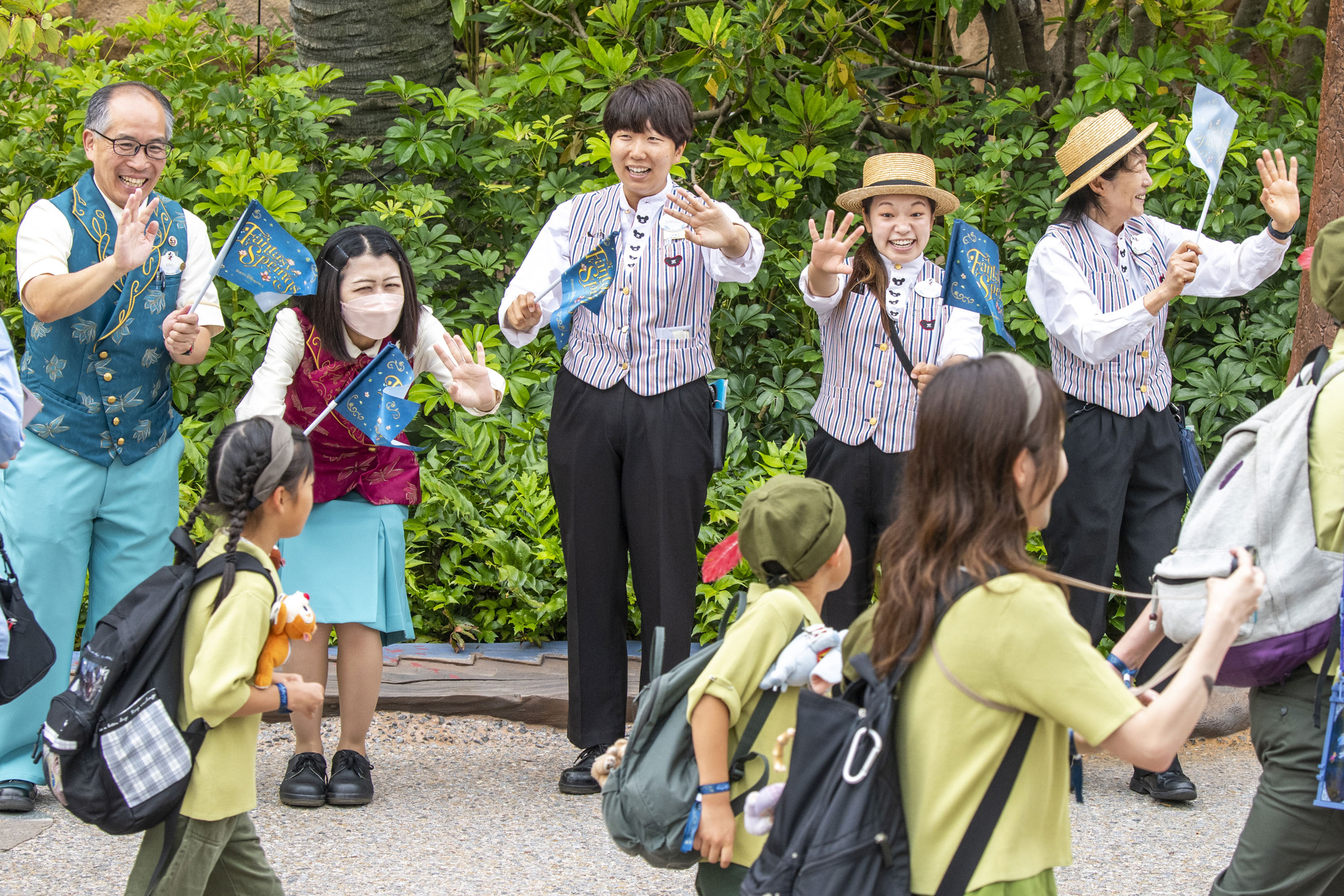 Cast members welcoming guests entering Fantasy Springs